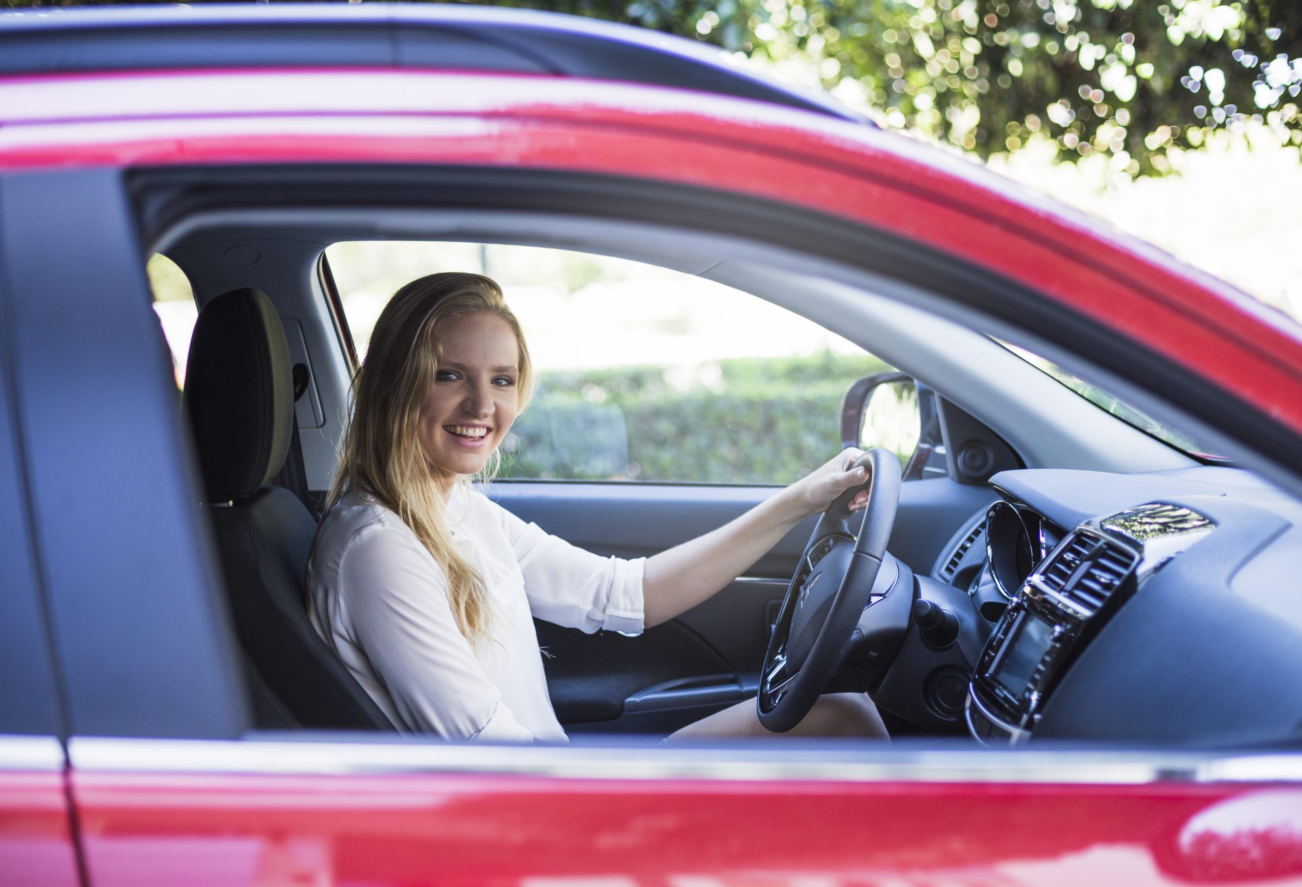 Woman calling for vehicle recovery after a breakdown